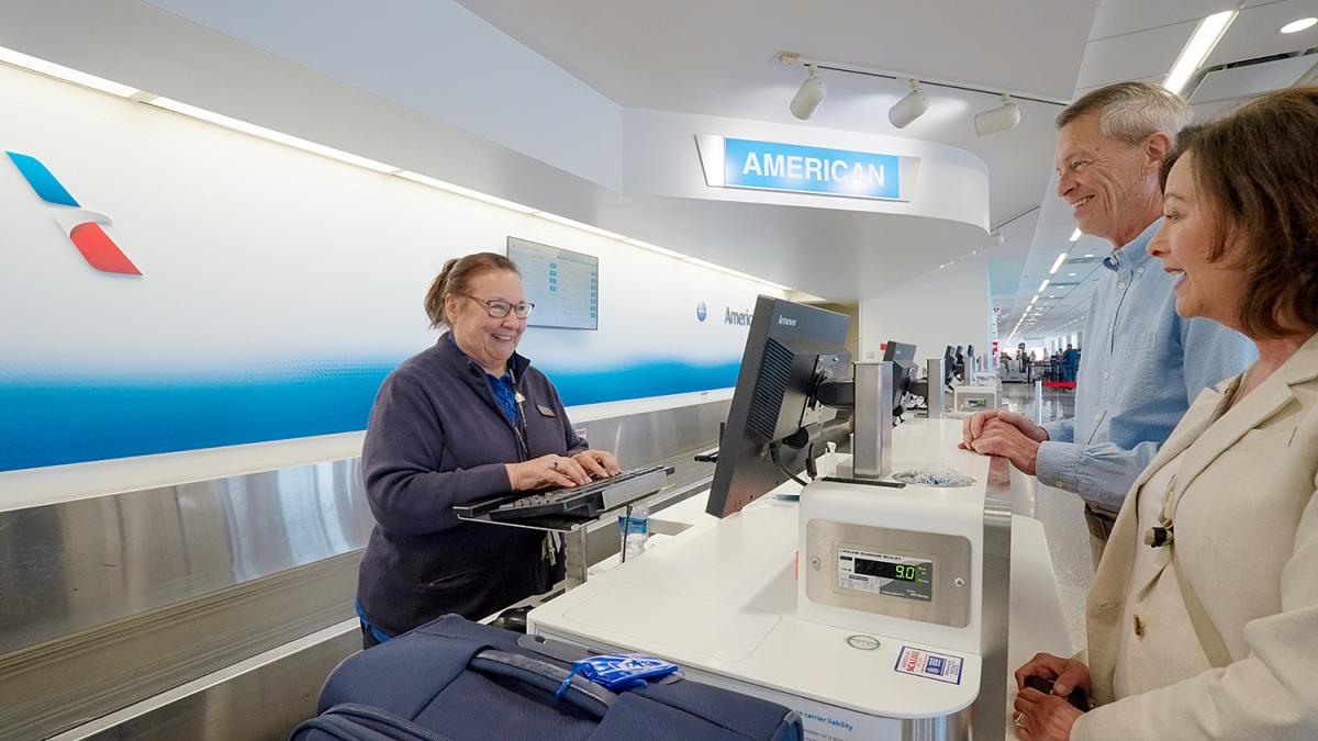 Couple checking in for flight